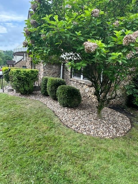 Fairmont Home Elegance with River Rock Landscaping