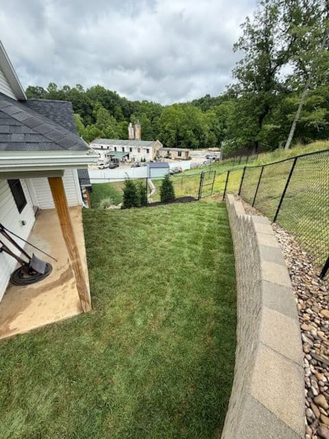 Transform Your Backyard with Sod and River Rock